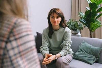 A woman attending an anger management therapy session.