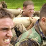 Military personnel in camouflage uniforms participating in a team-building exercise, highlighting the physical and mental challenges faced by veterans, who may benefit from EMDR sessions for military veterans to address trauma and improve mental health.