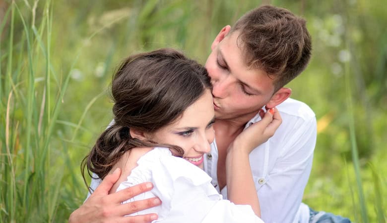 Young couple embracing lovingly in a field, symbolizing emotional connection and growth through couples counselling Toronto. Young couple embracing lovingly in a field, symbolizing emotional connection and growth through couples counselling Toronto.