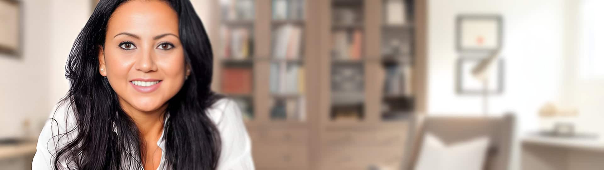Smiling therapist in a cozy office setting, representing accessible support options for those searching for EMDR therapy near me.