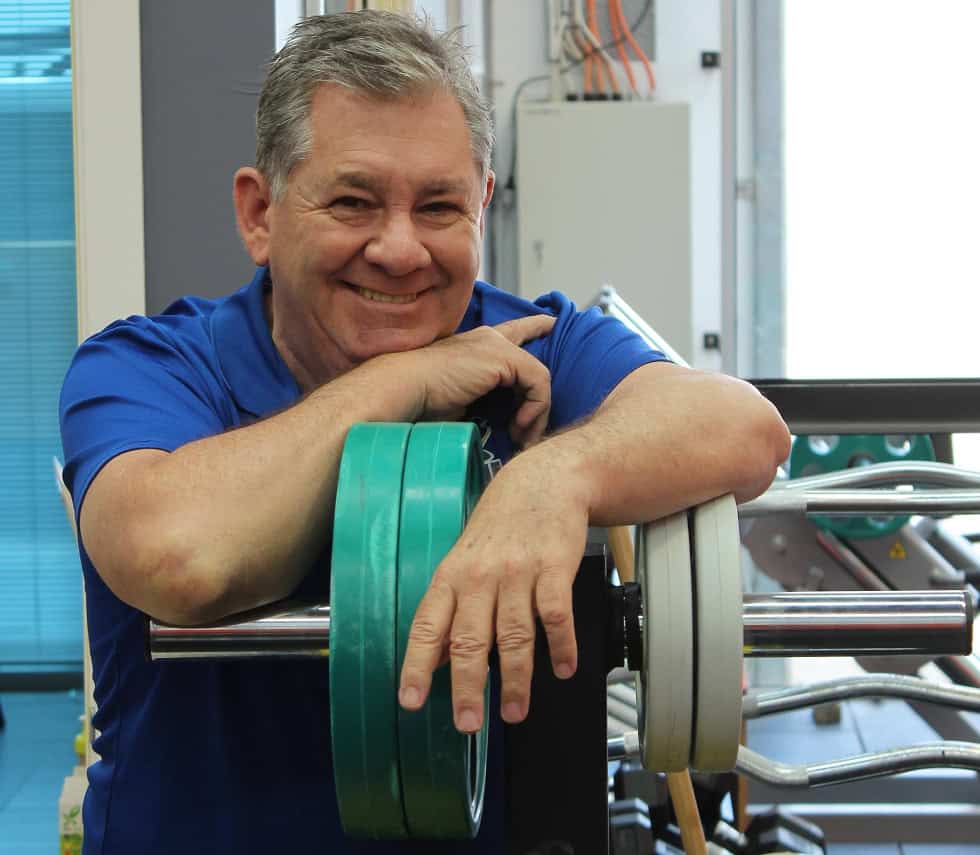 Smiling man at a gym, symbolizing positive life transitions for Veterans adjusting to civilian life with a focus on wellness and resilience. Smiling man at a gym, symbolizing positive life transitions for Veterans adjusting to civilian life with a focus on wellness and resilience.