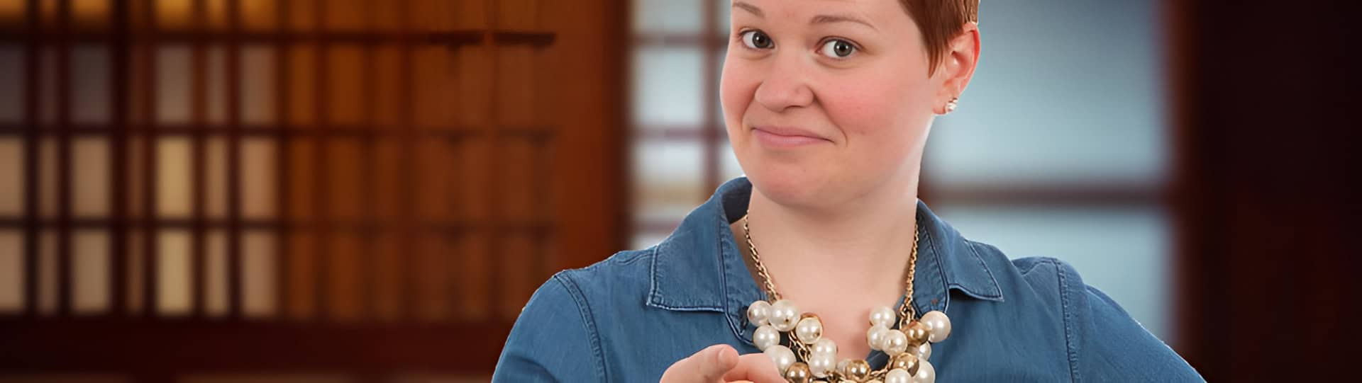 Confident woman pointing with a playful expression, representing approachable support for EMDR therapy in Orangeville.