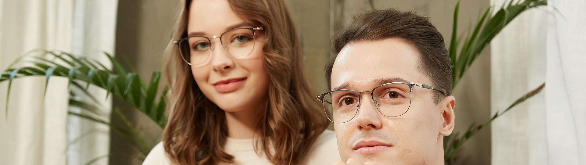 Young couple sitting together in a private setting, symbolizing trust and couples counselling confidentiality during therapy sessions.