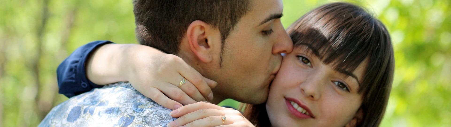 A close-up of a couple embracing outdoors, reflecting emotional connection and trust while respecting couples therapy boundaries like safe communication and support.